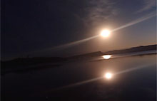 Still Image from a video of the solar eclipse mirrored in water taken using the Eclipse Camera 2019 app.